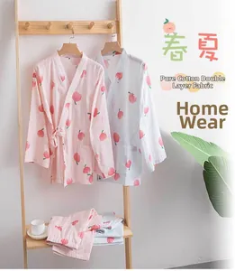 Detail of peach print and breathable double-layer cotton gauze fabric on kimono pajamas