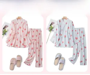 Detail of peach print cotton pajamas set showing kimono style tops and matching trousers