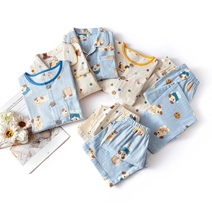 Kids cotton pajamas set with cute cartoon prints in light blue and cream white colors