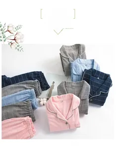 Flat lay of colorful plaid cotton pajama sets with notched collars in various colors