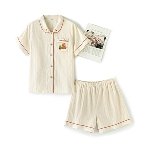 Cotton beige pajama set with short sleeves, bear embroidery and red contrast piping
