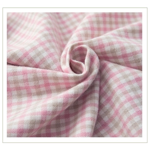 Detail of pink plaid brushed cotton fabric showing soft texture and woven pattern