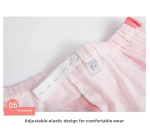 Detail of adjustable elastic waistband with transparent buckle on pink cotton pajama pants