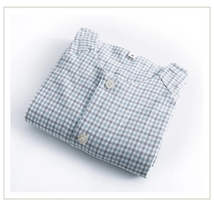 Detail of blue plaid cotton nursing shirt with soft brushed fabric and size M label