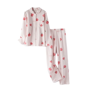 Pink quilted cotton pajama set with peach print and peach lettering on white background