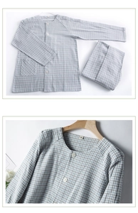 Close-up of cotton flannel pajamas featuring blue gingham pattern and buttoned pocket
