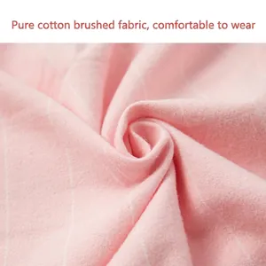 Pink cotton brushed flannel pajama fabric with soft texture and minimalist grid pattern