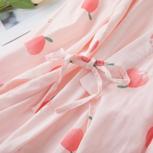 Pink cotton pajama set with peach print and adjustable drawstring waist detail