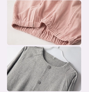 Detail of pink waffle fabric and grey brushed cotton shirt with button collar