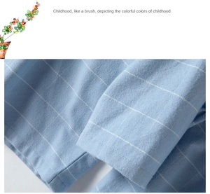 Close-up of light blue striped cotton fabric showing fine stitching and soft texture