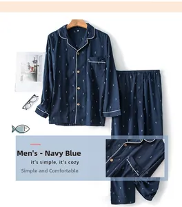 Detail of navy blue cotton pajamas featuring white fish print and contrast piping