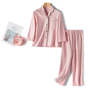 Pink checkered cotton kids pajama set with long sleeves and a matching toy bag