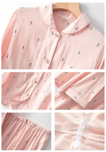 Detail view of cotton pajama set featuring wood buttons, fish print and seam stitching