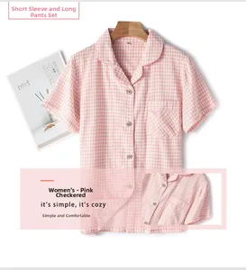 Close-up of women's pink checkered short-sleeve pajama top with lapel and buttons