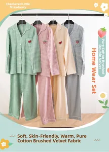 Detail of four colorful checkered cotton flannel pajama sets with fruit embroidery accents