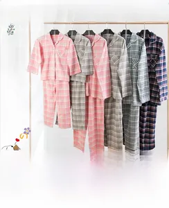 Detail of soft cotton plaid pajamas with front pocket and brushed flannel texture