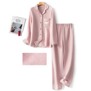Pink quilted cotton pajama set for women featuring long sleeves and bird embroidery