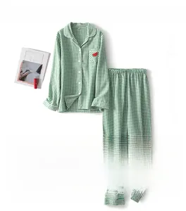 Detailed view of watermelon embroidery on green plaid cotton pajama set for women