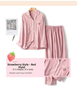 Close-up of pink checkered cotton pajamas with cute strawberry embroidery and soft texture