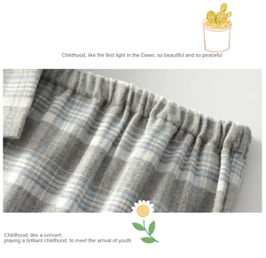Close-up of comfortable elastic waistband on grey and white plaid cotton pajamas
