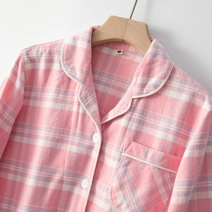 Kids pink checkered flannel pajama top with classic collar and white buttons
