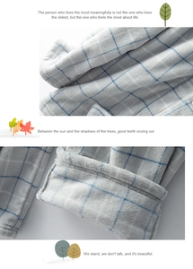Détail du tissu de pyjama en flanelle 300g doux avec motif à carreaux bleus et couture