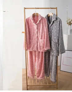 Close-up of star pattern coral fleece pajamas with thick double-sided plush and large pockets