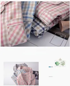 Detail of checkered cotton pajamas featuring classic lapel collar and contrast piping