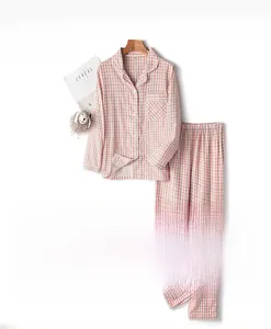 Detail of pink gingham cotton pajamas set with lapel collar and white piping decoration