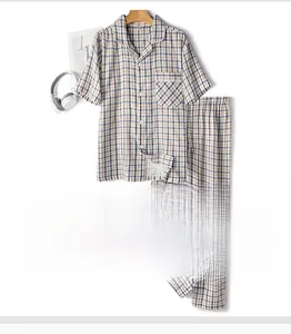 Close-up of navy blue plaid cotton pajama set with shirt collar and fabric texture