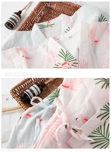 Detail of pink and blue flamingo print cotton kimono robes with V-neck and waist ties