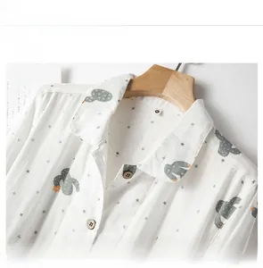 Detail showing the Peter Pan collar and cactus print on breathable white cotton pajamas