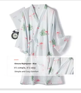 Close-up of blue cotton kimono nightgown featuring pink flamingo and palm leaf prints