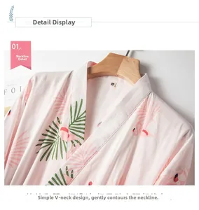 Detail of V-neck collar on soft pink cotton kimono with flamingo and palm leaf prints