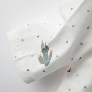 Women's cotton cactus print pajama set with long sleeves and pants in a minimalist style