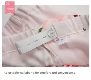 Detail of adjustable elastic waistband with button on pink floral cotton pajama pants