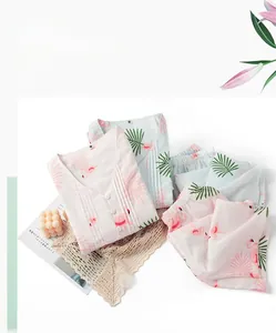 Detail of flamingo print pajamas featuring ruffled edges and fine pleated cotton texture