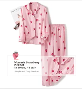 Close-up of pink cotton pajama set featuring strawberry print and button-down collar