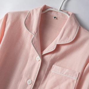 Pink houndstooth cotton pajamas for kids with lapel collar and button-up front