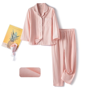 Pink cotton plaid pajama set for children with soft breathable fabric texture and piping
