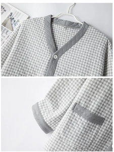 Detail of grey houndstooth quilted pajama set featuring V-neckline and pocket stitching