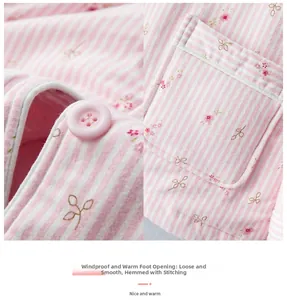 Close-up of pink striped floral thermal pajamas showing buttons and rectangular pocket