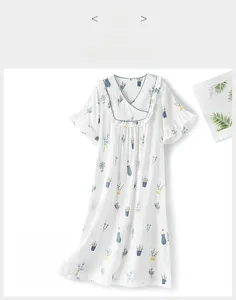Front view of white short-sleeved cotton nightgown with green potted plant prints