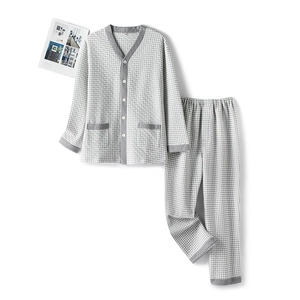 Quilted houndstooth pajama set for couples featuring grey piped edges and V-neckline