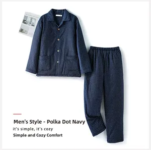 Detail of navy blue men's pajama set with white polka dots and thick cotton fabric texture