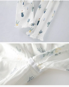 Detail of cotton home wear showing botanical print and delicate ruffled edge stitching