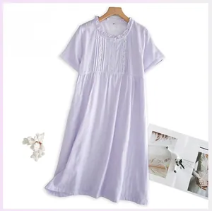 Detail of purple plaid cotton sleepwear featuring lace trim and ruffled collar design