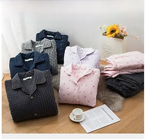 Close-up of stacked thick quilted thermal pajamas set with various patterns and soft texture