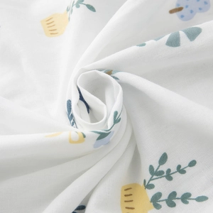 Cotton gauze home set fabric with delicate cartoon botanical floral patterns in yellow and blue