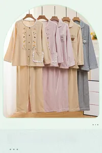 Detail of cotton plaid pajama sets with lace trim collar and floral embroidery motifs